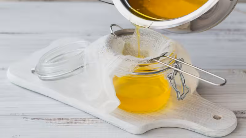 Ilustração sobre manteiga ghee, associada a alimentação saudável, gorduras boas, estabilidade térmica e propriedades nutricionais